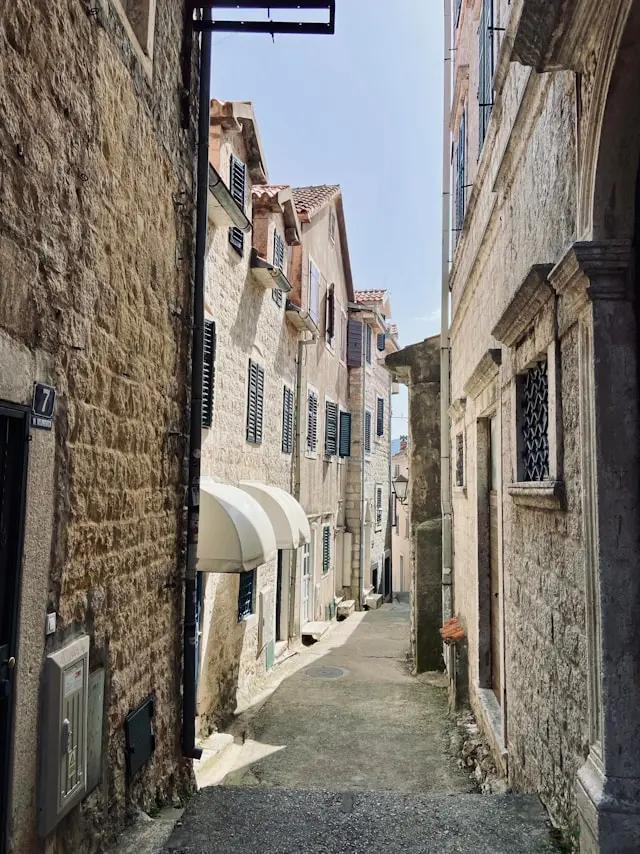 Narrow historic stone alley in the old town of Herceg Novi, Montenegro