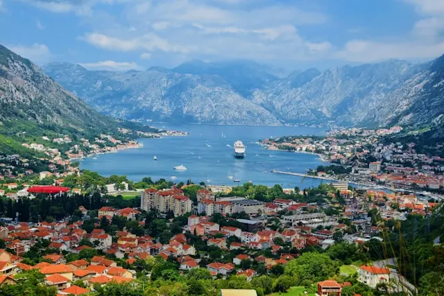 Aerial view of Kotor and the Bay of Kotor with mountains and cruise ships