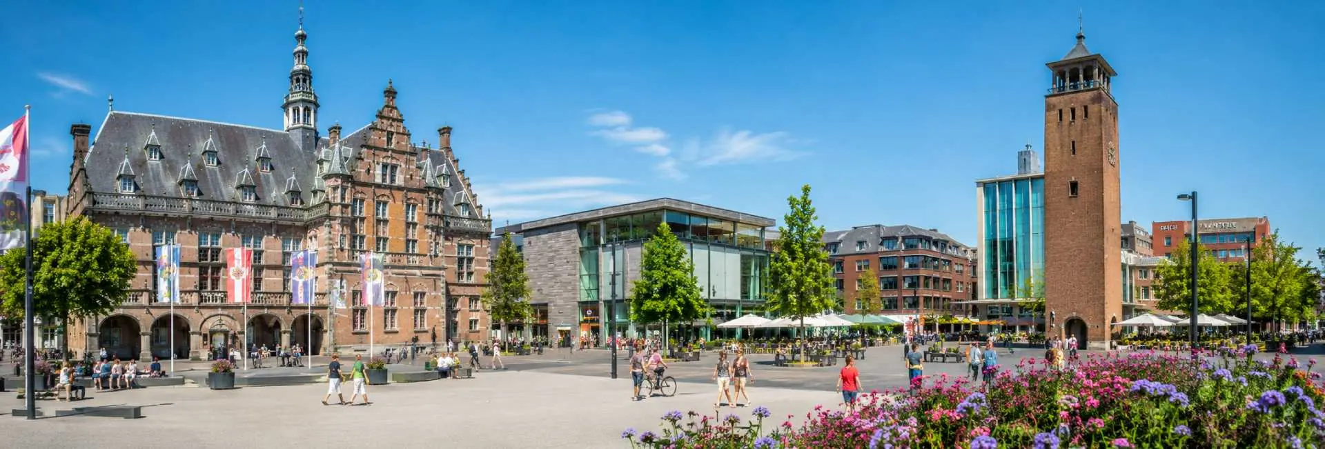 Enschede city center with historic architecture, modern buildings, and a lively pedestrian square