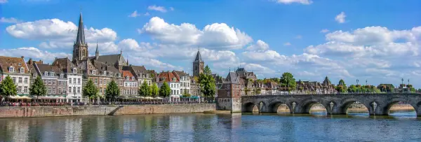 Maastricht Netherlands with historic buildings, River Maas and Sint Servaasbrug