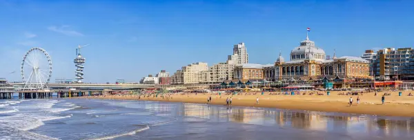 Scheveningen beach and pier with Ferris wheel and historic Kurhaus in the Netherlands