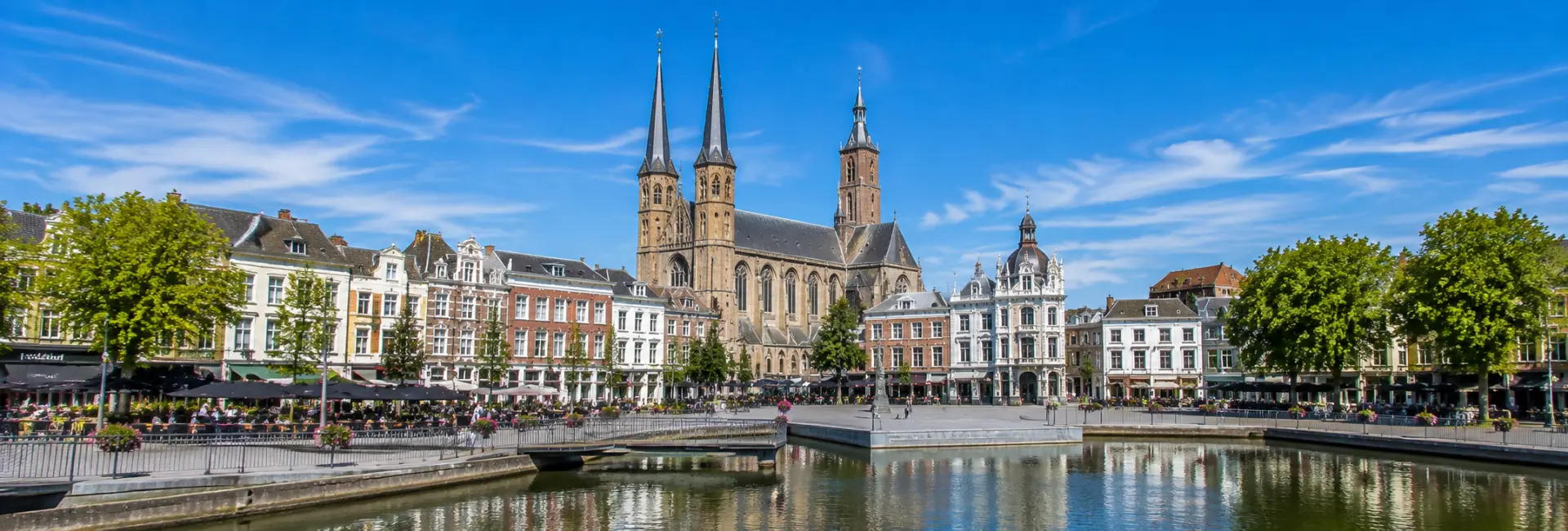 Tilburg, Netherlands city centre with Heuvelse Kerk, historic buildings and lively Heuvel square