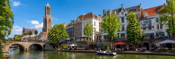 Utrecht historic canal with Dom Tower and traditional Dutch buildings