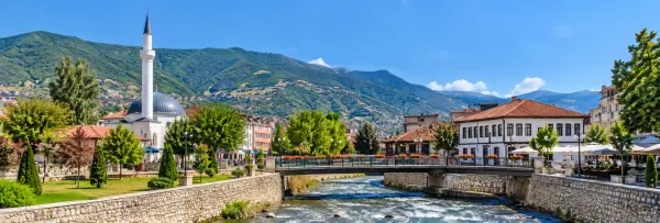 Gostivar, North Macedonia with its riverside promenade, mosque, historic buildings and surrounding mountains