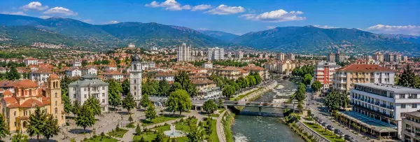 Strumica panoramic view with historic churches, city center, green hills and mountains