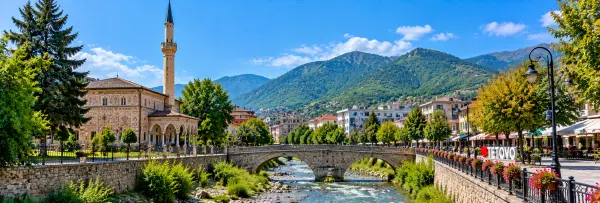 Tetovo, North Macedonia, with the colorful Šarena Džamija, Pena River, historic bridge, and Šar Mountains