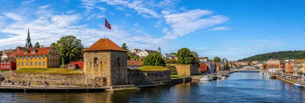 Fredrikstad, Norway waterfront with historic fortress walls, colorful buildings, river and boats