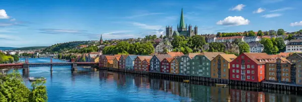 Trondheim, Norway panoramic view of colorful Nidelva waterfront buildings and Nidaros Cathedral