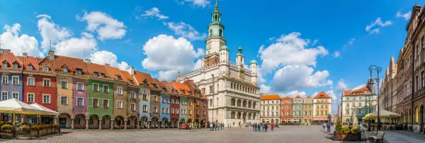 Poznań Old Market Square with the Renaissance Town Hall and colorful historic merchant houses in Poland.