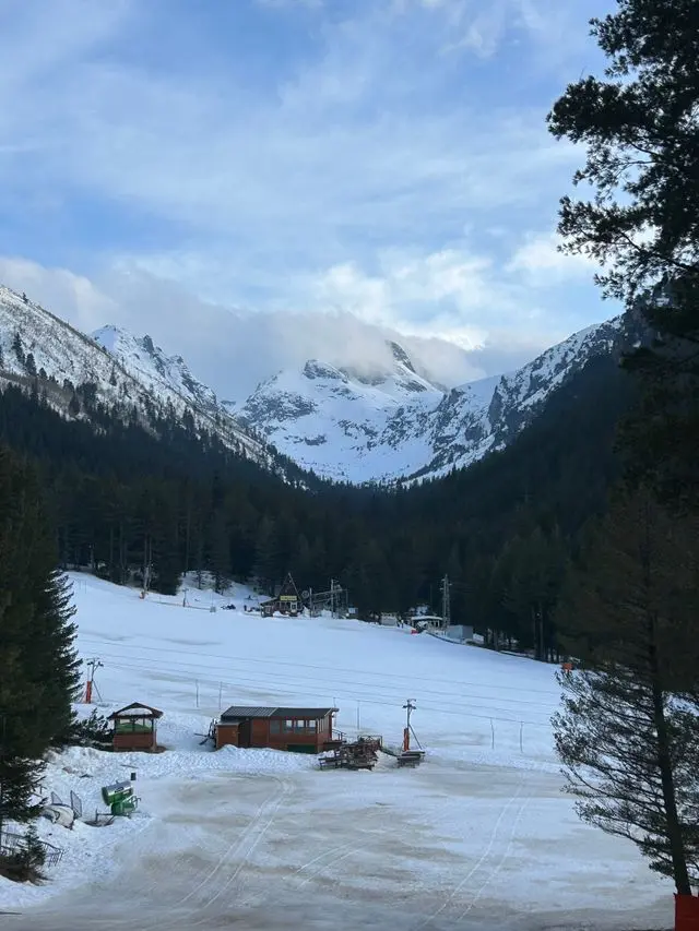 Snow-covered ski slope with the Tatra Mountains in Zakopane, Poland