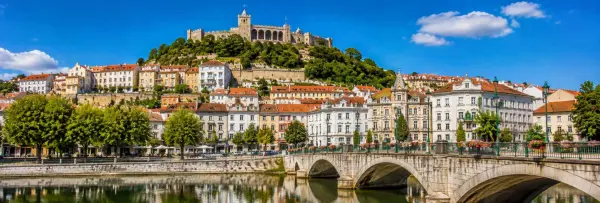Leiria, Portugal cityscape with historic buildings and Leiria Castle on a green hill
