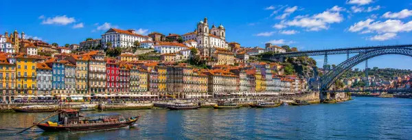 Porto Portugal cityscape with colorful Ribeira buildings, Douro River and Dom Luís I Bridge