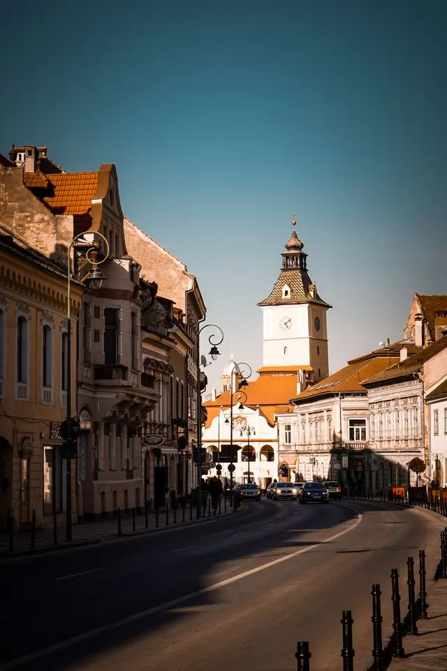 Historic street and clock tower in Brașov Old Town, Romania