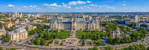 Aerial panoramic view of Iași, Romania, featuring the Palace of Culture and surrounding cityscape