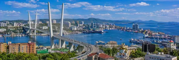 Vladivostok, Russia with the Golden Bridge, harbor, coastline and surrounding hills