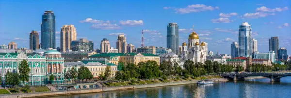 Yekaterinburg, Russia skyline with the Iset River, historic buildings, church and modern towers