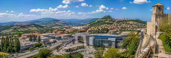 Serravalle in San Marino with historic fortress, terracotta rooftops and green hills