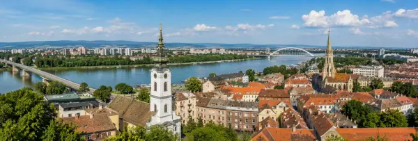 Novi Sad, Serbia panoramic city view with the Danube River, historic rooftops and church towers