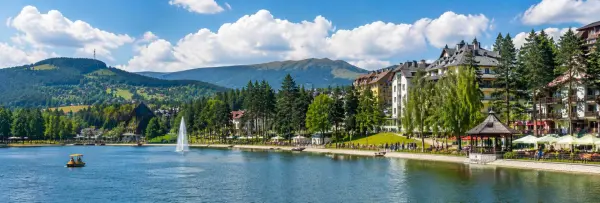 Zlatibor, Serbia with a scenic lake, mountain landscape and lakeside promenade