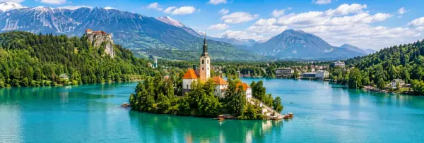 Lake Bled with Bled Island, church, castle and Alpine mountains in Bled, Slovenia.