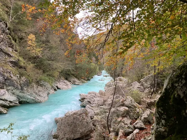 Turquoise Soča River flowing through a rocky gorge near Bovec, Slovenia