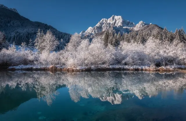 Snow-covered Lake Jasna with the Julian Alps in Kranjska Gora, Slovenia