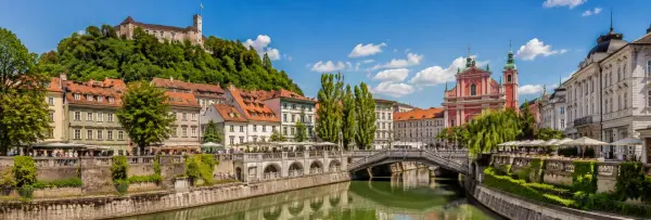 Ljubljana, Slovenia cityscape with the Ljubljanica River, Triple Bridge, historic buildings and Ljubljana Castle