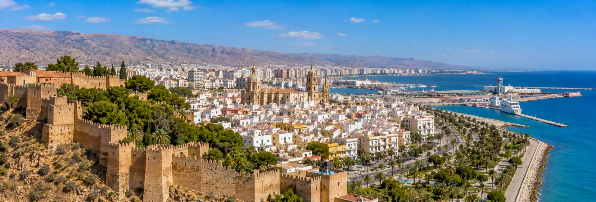 Almería, Spain, with the Alcazaba, cathedral, Mediterranean coast and rugged mountains