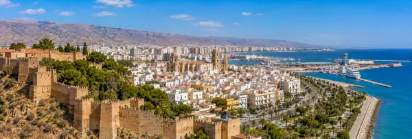 Almería, Spain, with the Alcazaba, cathedral, Mediterranean coast and rugged mountains