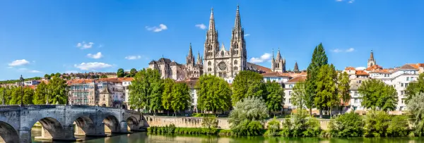 Burgos, Spain skyline with the Gothic Cathedral, historic buildings, river and stone bridge