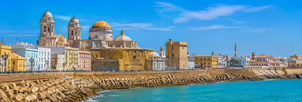 Cádiz, Spain panoramic view of Cádiz Cathedral, historic waterfront and turquoise Atlantic waters