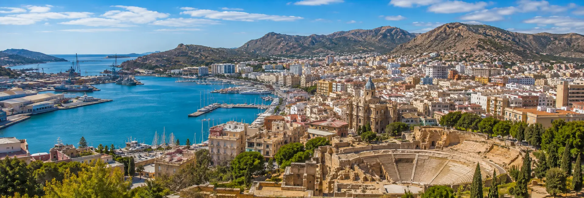 Cartagena, Spain skyline with Roman Theatre, historic city and Mediterranean harbor