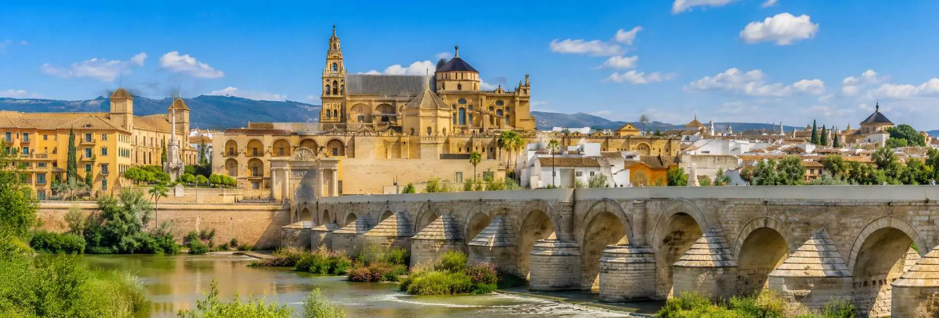 Mosque-Cathedral and Roman Bridge in Córdoba, Spain, beside the Guadalquivir River
