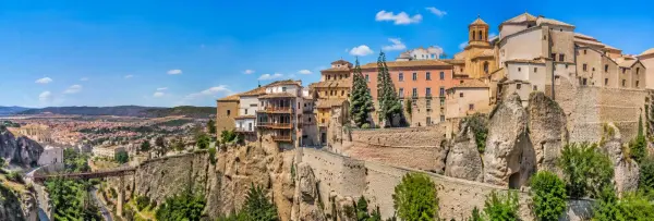 Cuenca, Spain, with historic cliffside buildings and hanging houses overlooking the scenic gorge
