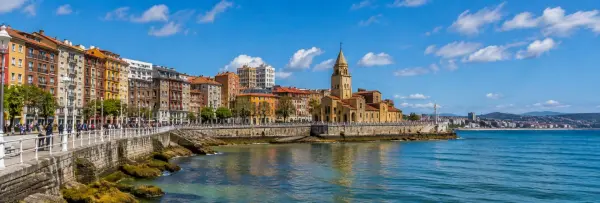 Gijón Spain waterfront with coastal promenade, historic architecture, and the Cantabrian Sea