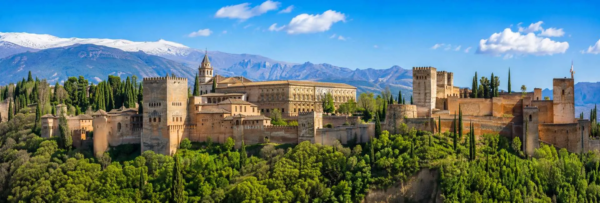 Granada, Spain with the historic Alhambra overlooking the city and Sierra Nevada mountains