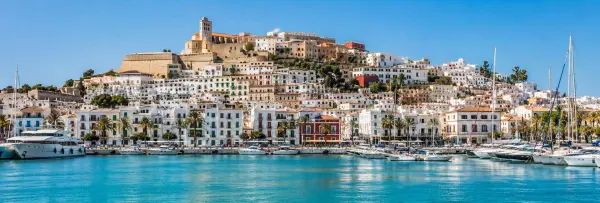 Ibiza, Spain panoramic view of Dalt Vila, marina, whitewashed buildings and turquoise Mediterranean waters