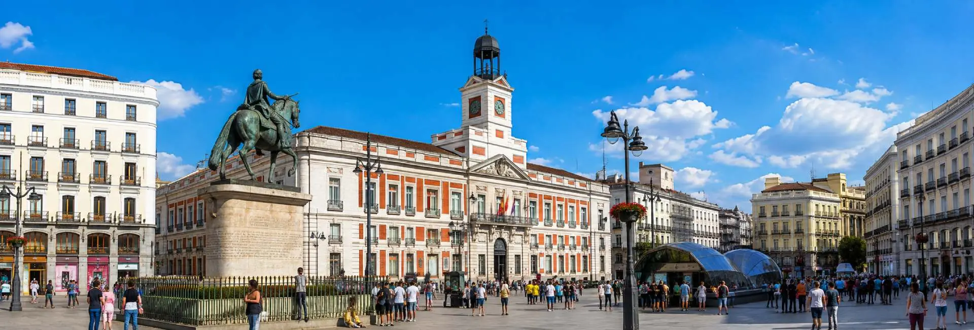 Madrid cityscape with historic Puerta del Sol and surrounding architecture in bright daylight