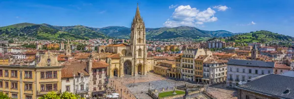 Oviedo, Spain skyline with Oviedo Cathedral, historic center and green Asturian mountains