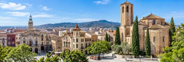 Historic center of Terrassa, Spain, featuring Sant Pere church and surrounding cityscape