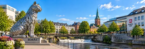 Borås, Sweden, featuring the iconic public art, Viskan River, city center, and historic skyline