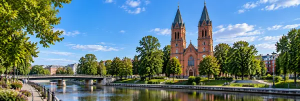 Klosters Church in Eskilstuna, Sweden, beside the Eskilstunaån river and leafy Stadsparken