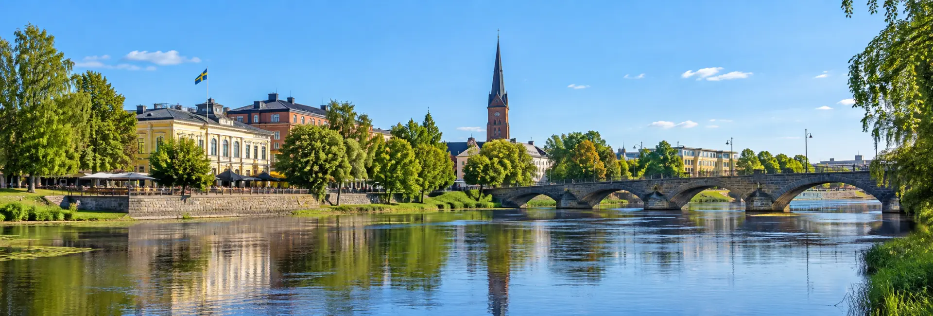 Karlstad, Sweden waterfront with the Klarälven river, historic stone bridge, and Karlstad Cathedral