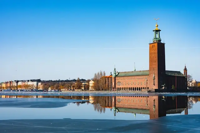 Stockholm City Hall beside a frozen waterfront