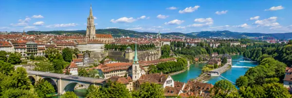 Bern, Switzerland with the historic Old Town, Bern Minster, Aare River, and red-tiled rooftops