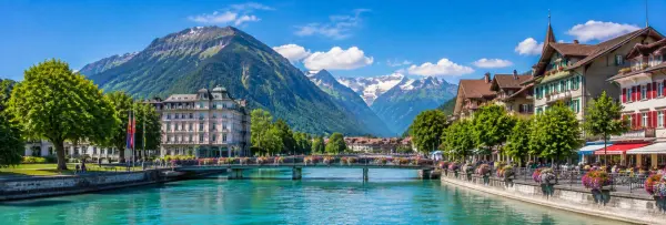 Interlaken town with traditional Swiss buildings and snow-capped Alps in Switzerland