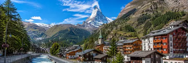 Zermatt village with traditional chalets and the snow-capped Matterhorn in Switzerland