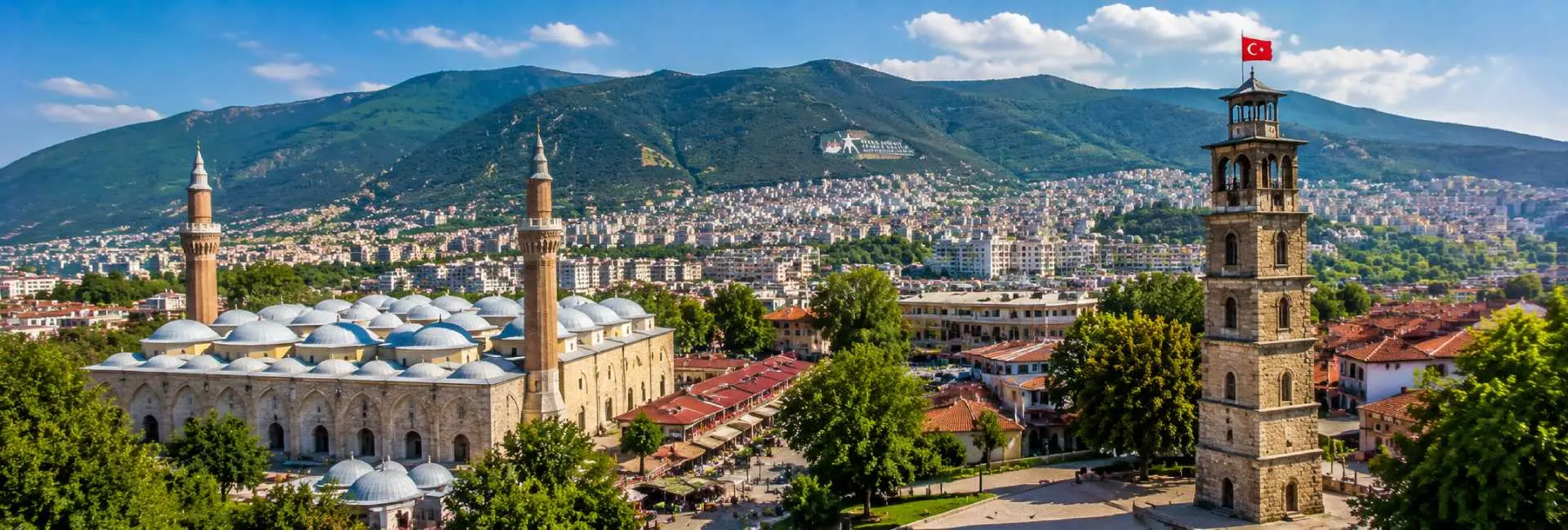 Bursa Grand Mosque and historic city center with Uludağ mountains in Türkiye