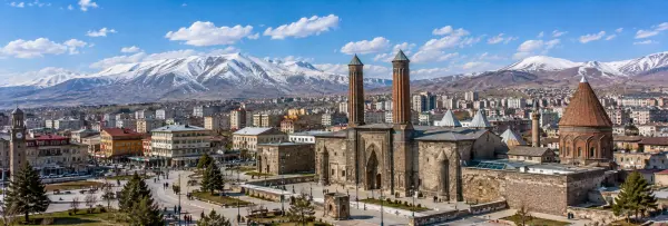 Erzurum, Türkiye skyline with historic Seljuk architecture and snow-capped mountains