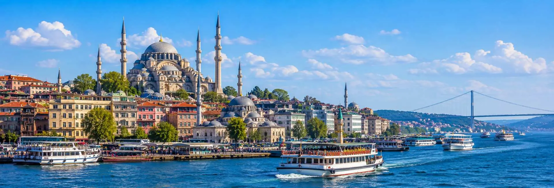 Istanbul panoramic cityscape with Ottoman mosques and ferries on the Bosphorus